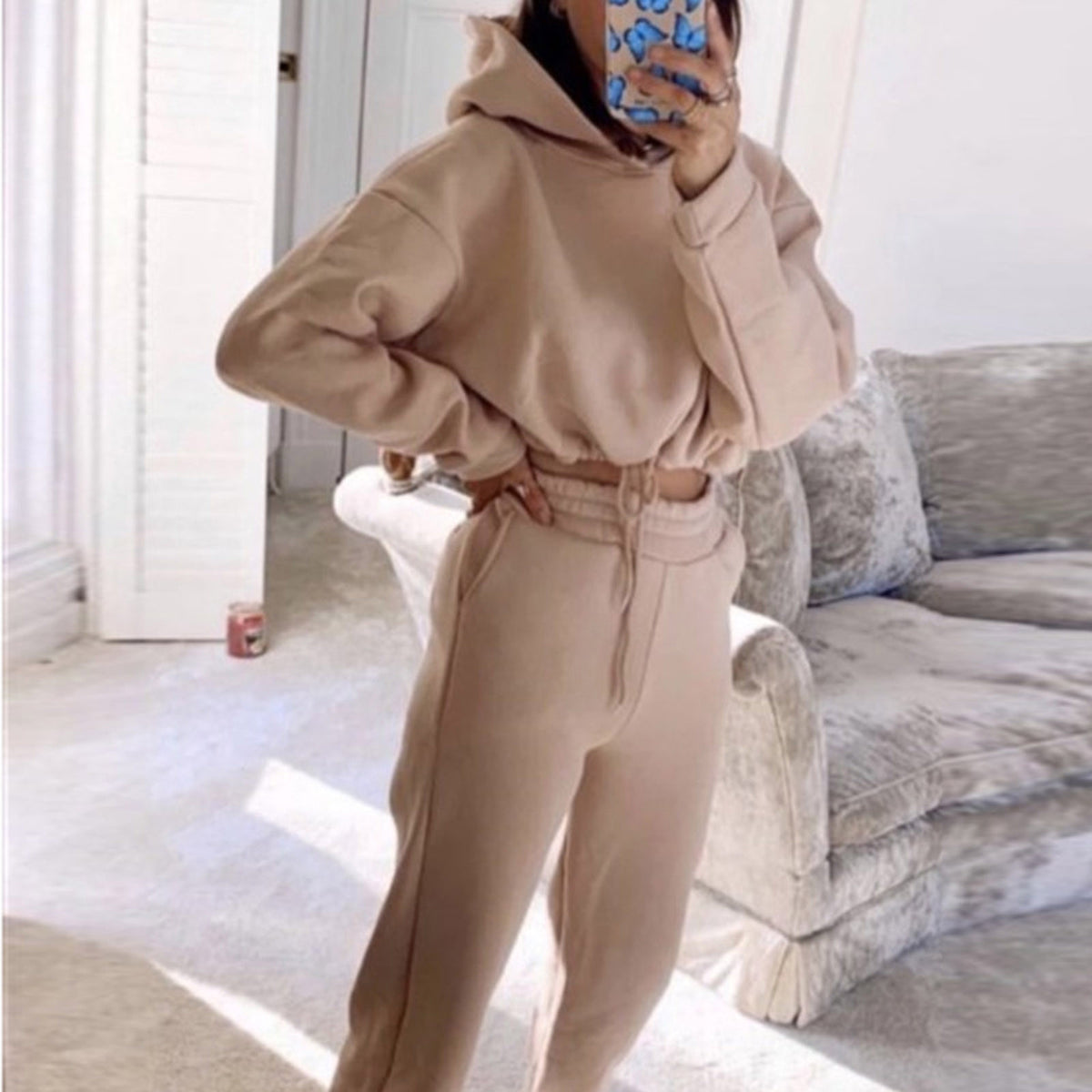 Woman in cropped hoodie and joggers