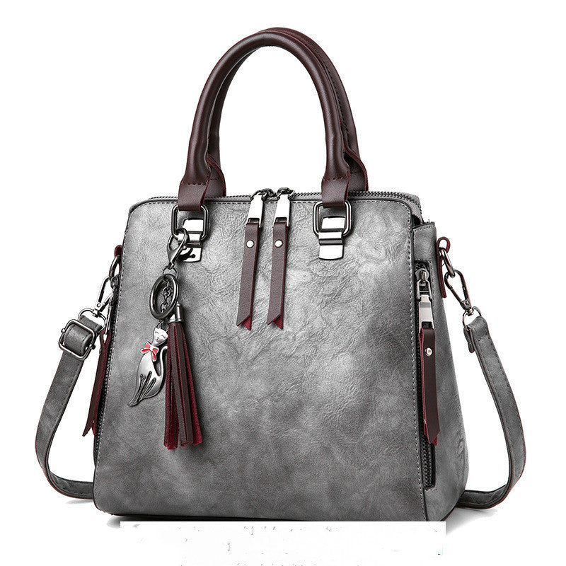 Vintage faux leather handbag with tassel