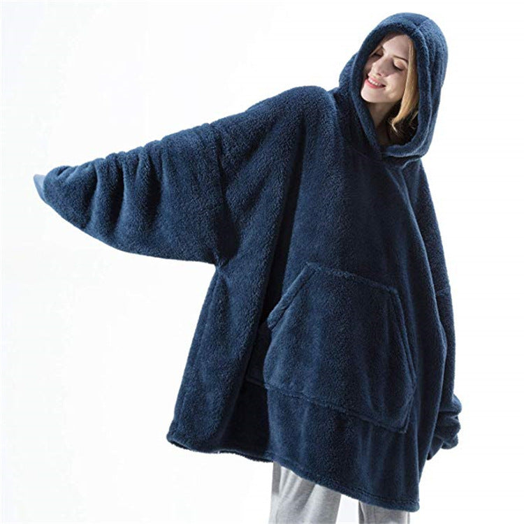 Person relaxing in an oversized blanket hoodie