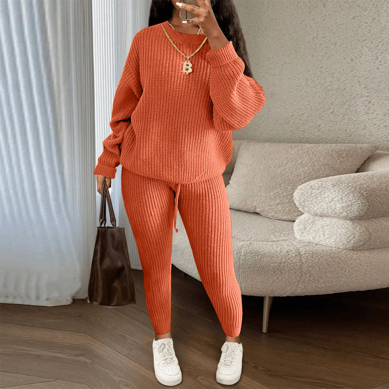 Woman in ribbed knit jumper and trousers set