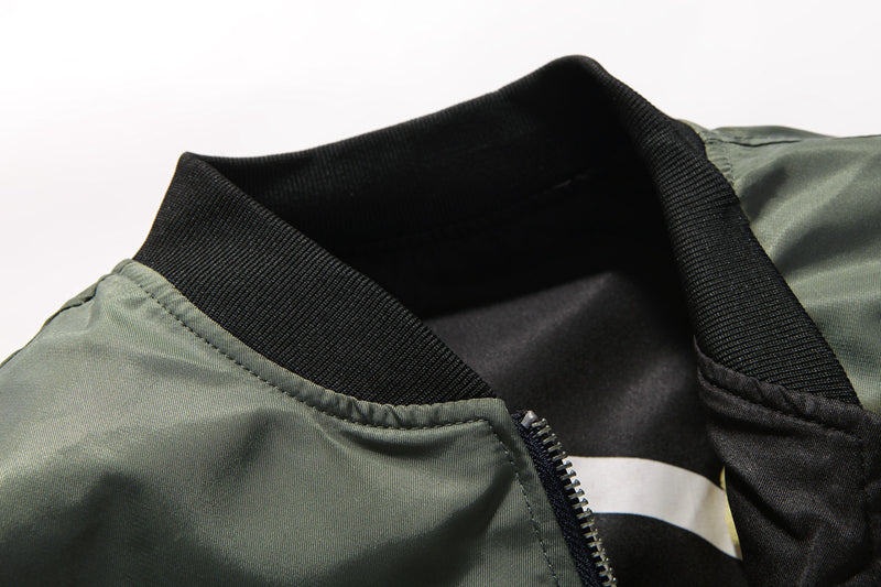Man wearing a reversible bomber jacket