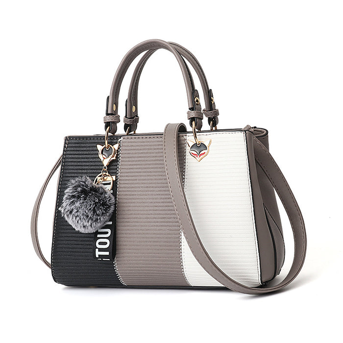Evie | Colour-block handbag with pompom charm