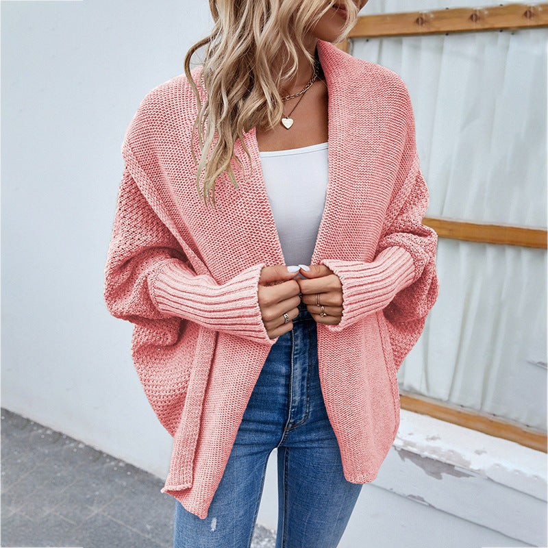 Woman in oversized chunky knit cardigan