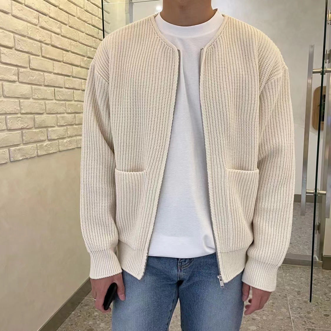 Man wearing a chunky rib knit zip cardigan