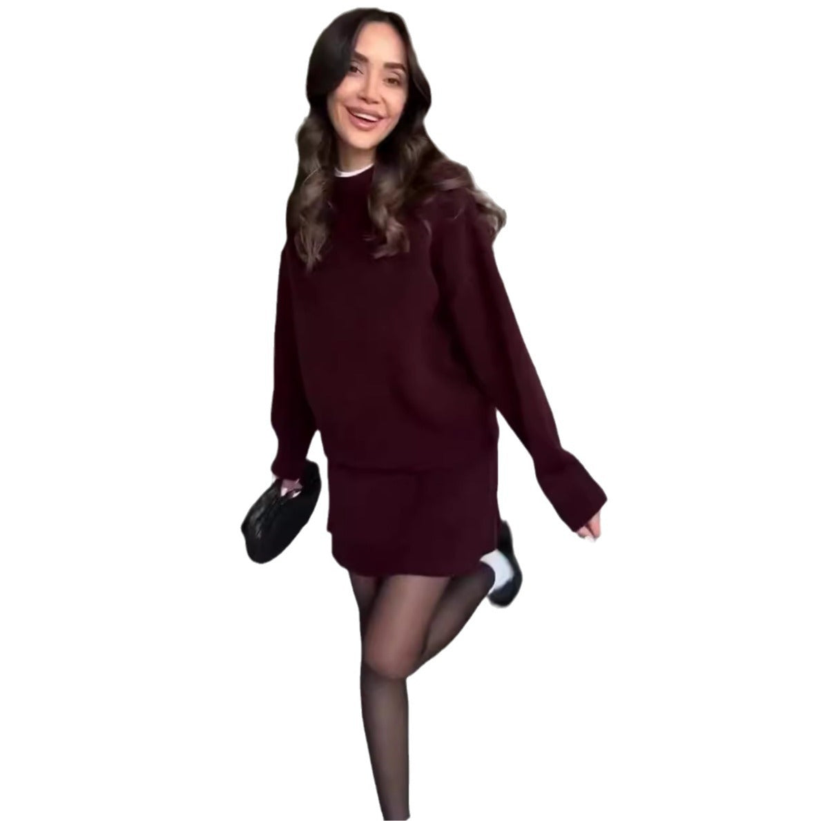 Woman in matching knitted jumper and mini skirt