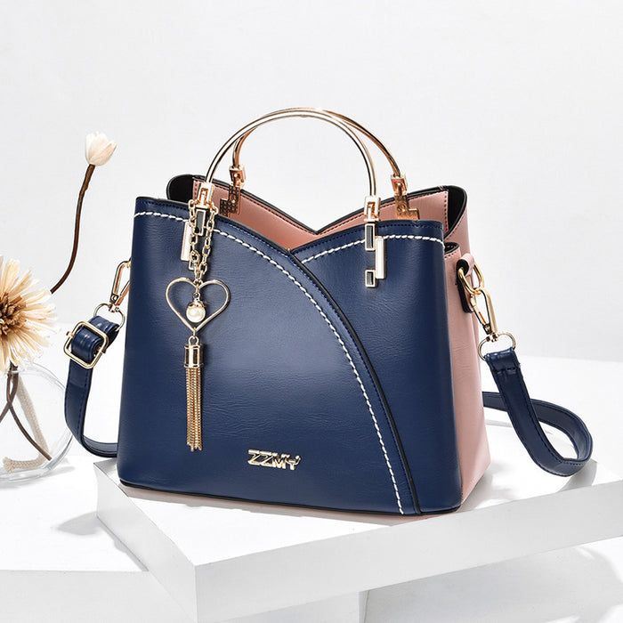 Imogen | Colour block handbag with heart tassel