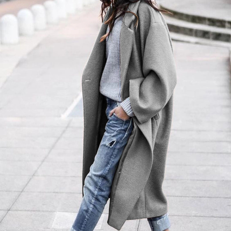 Woman wearing long oversized lapel coat