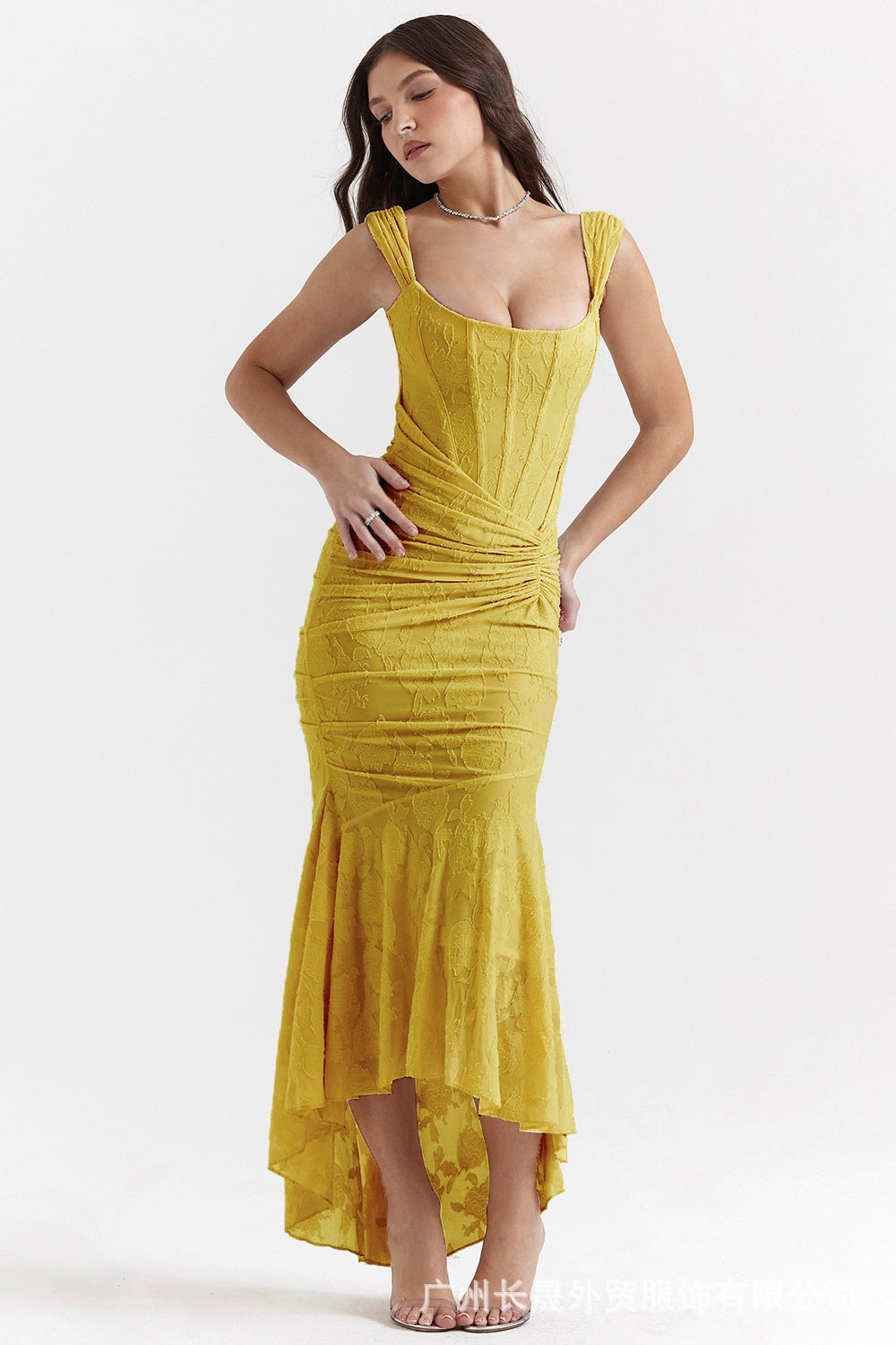 Woman in an off-shoulder ruched maxi dress