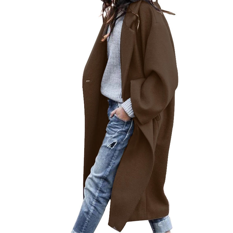 Woman wearing long oversized lapel coat