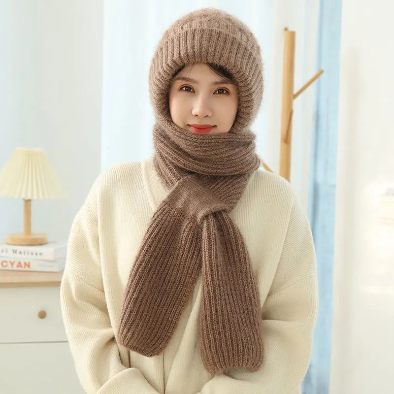 Woman wearing a knitted hood with attached scarf