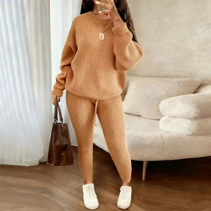 Woman in ribbed knit jumper and trousers set