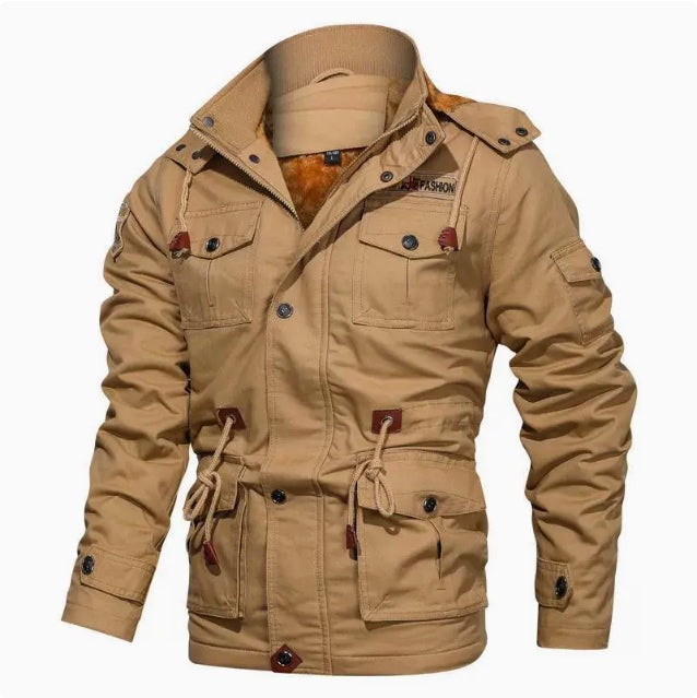Man wearing a hooded military-style jacket