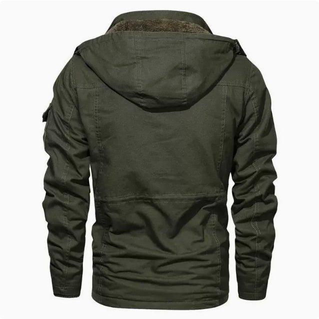 Man wearing a hooded military-style jacket