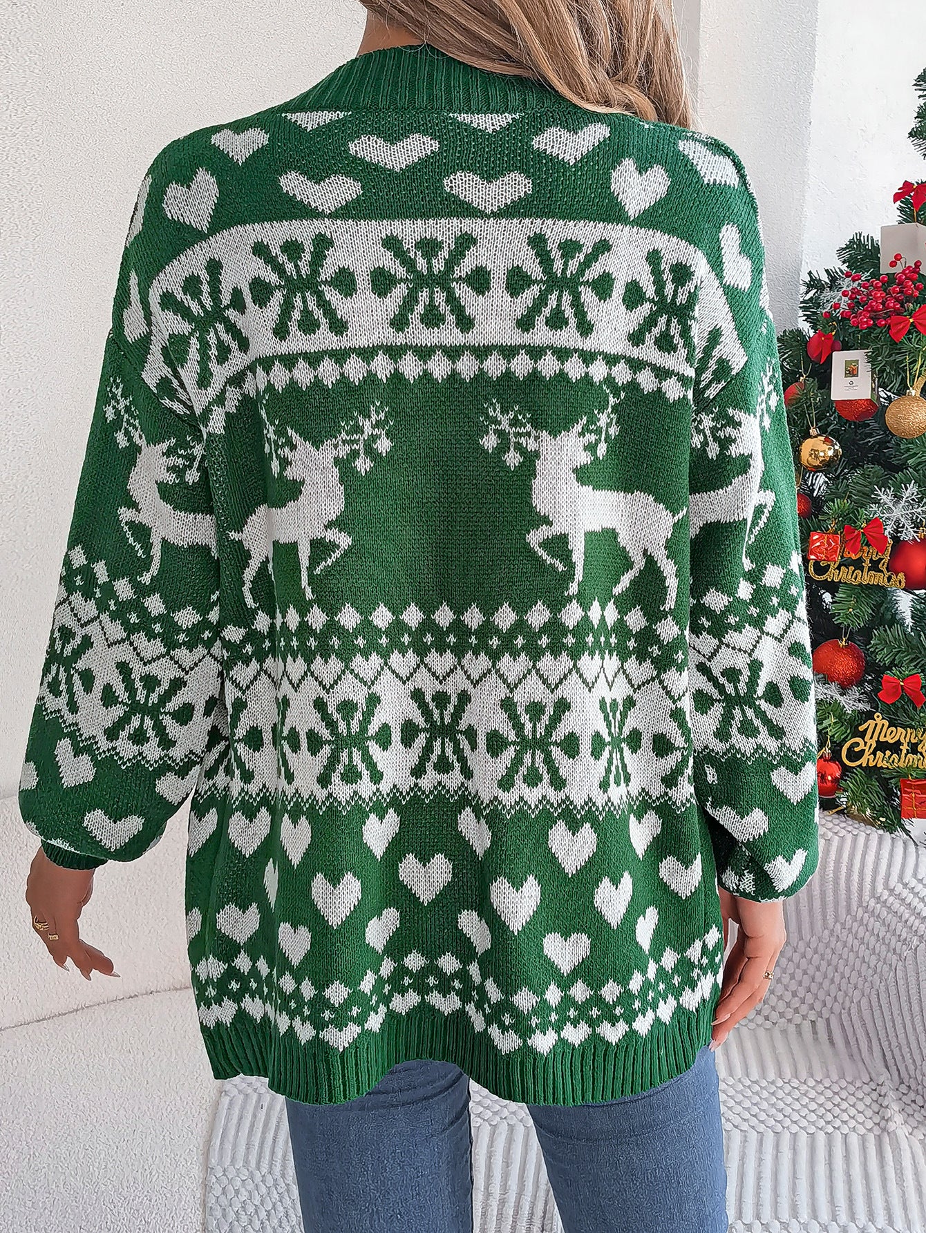 Woman in a reindeer Christmas cardigan